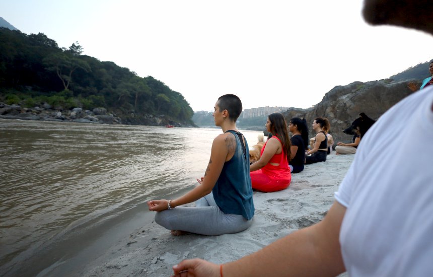 evening meditation practice at the beach of ganga